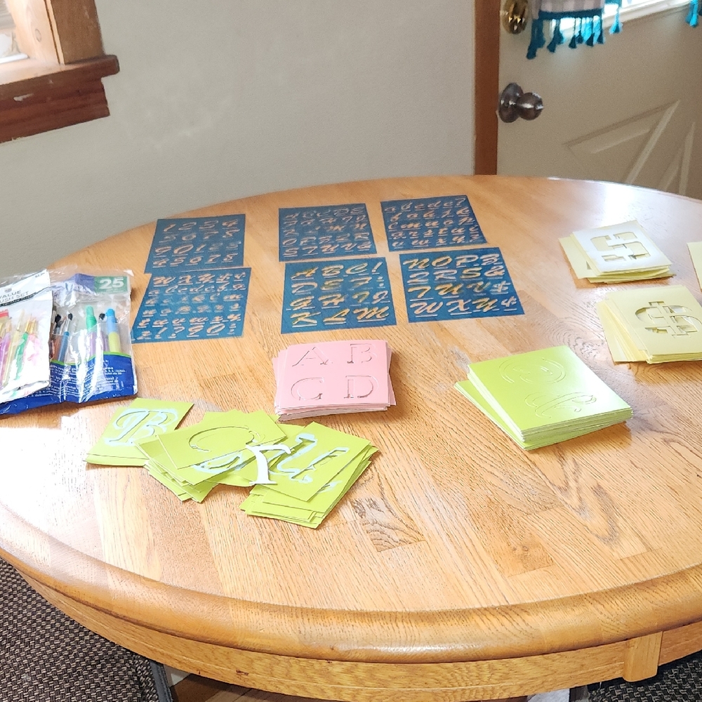 Various Stensils And Paint Brushes